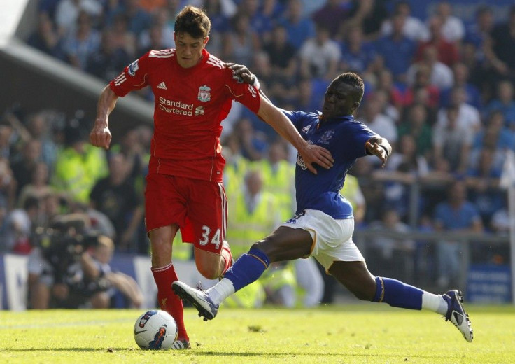 Everton's Drenthe challenges Liverpool's Kelly during their English Premier League soccer match in Liverpool