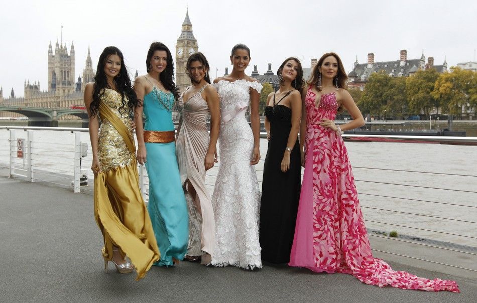 Miss World 2011 contestants pose for photographers in front of the Houses of Parliament and the Big Ben clocktower in London