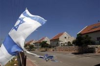 An Israeli flag waves in the West Bank Jewish settlement of Ofra