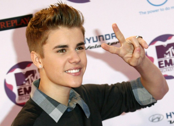 Canadian pop star Justin Bieber poses on arrival on the red carpet at the MTV Europe Music Awards show in Belfast