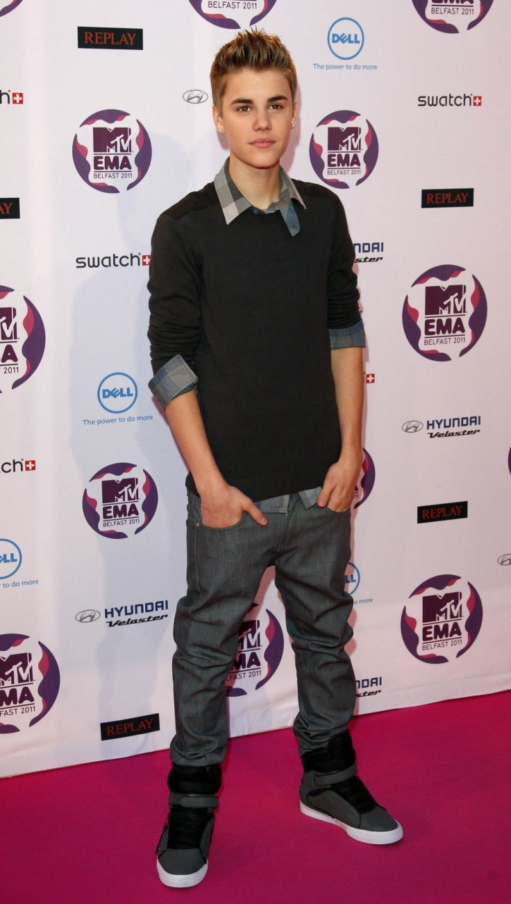 Canadian pop star Justin Bieber poses on arrival on the red carpet at the MTV Europe Music Awards show in Belfast