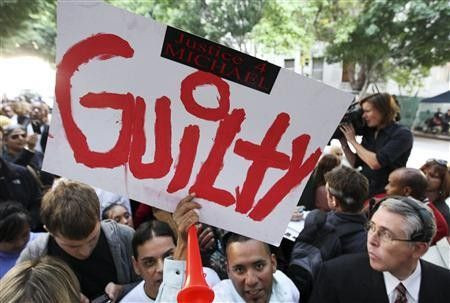 Michael Jackson fans wait outside the courthouse for the reading of the verdict in Dr. Conrad Murray's trial in Los Angeles
