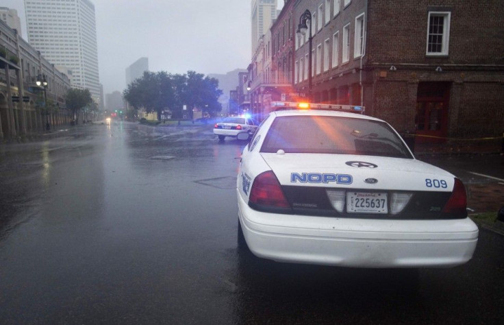 Police cars stand watch over a French Quarter intersection as Hurricane Isaac hits New Orleans
