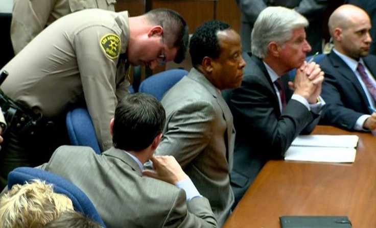 Dr. Conrad Murray is handcuffed as he is remanded into custody in Los Angeles