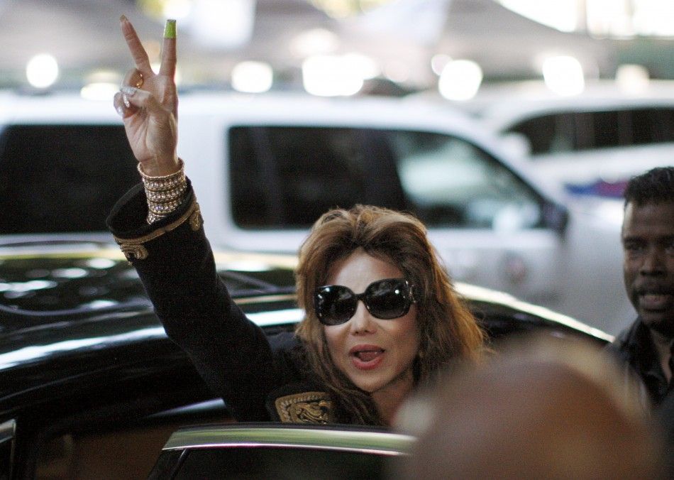 LaToya Jackson waves a victory sign as she leaves the courthouse following a guilty verdict in the Dr. Conrad Murray trial in Los Angeles