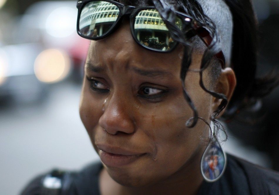 Michael Jackson fan Jana Bates cries with the courthouse reflected in her glasses in Los Angeles