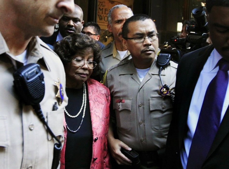 Katherine Jackson is surrounded by police officers as she leaves the courthouse after the reading of the guilty verdict in Dr. Conrad Murrays trial in Los Angeles