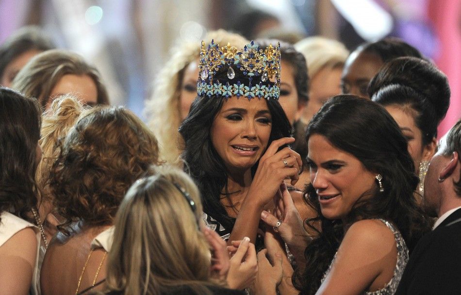 Miss Venezuela, Ivian Sarcos, is congratulated by other contestants after being crowned Miss World 2011 in Earls Court in west London