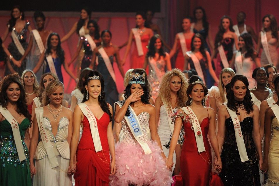 Miss Venezuela, Ivian Sarcos, joins other contestants on stage after being crowned Miss World 2011 in Earls Court in west London