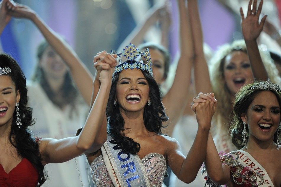  Miss Venezuela, Ivian Sarcos, holds hands with other contestants after being crowned Miss World 2011 in Earls Court in west London