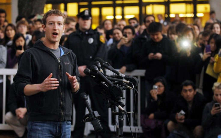 Mark Zuckerberg speaks to reporters at Harvard University in Cambridge
