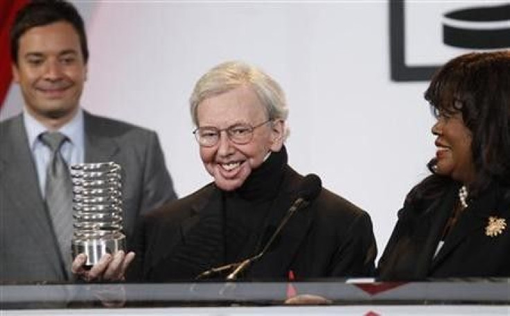 Film critic Roger Ebert accepts the Person Of The Year award with his wife, Chaz, at the Webby Awards in New York June 14, 2010.