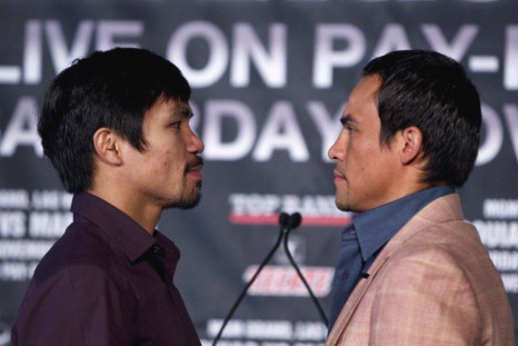 Manny Pacquiao of the Philippines and Juan Manuel Marquez of Mexico pose in New York, during a news conference on their upcoming boxing fight for Pacquiao&#039;s WBO welterweight title