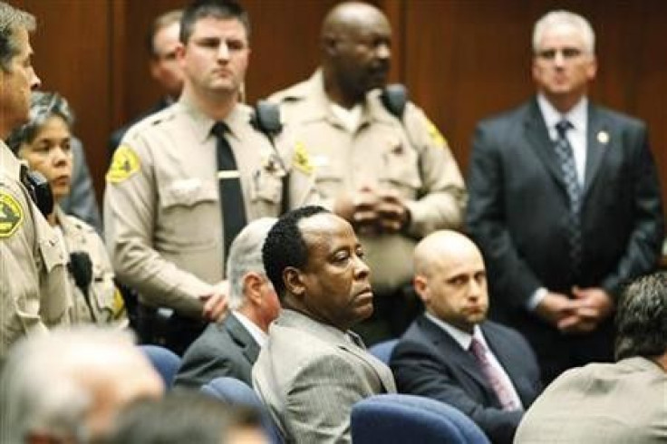 Dr. Conrad Murray (C) remains expressionless as the jury returned with a guilty verdict in his involuntary manslaughter trial in Los Angeles