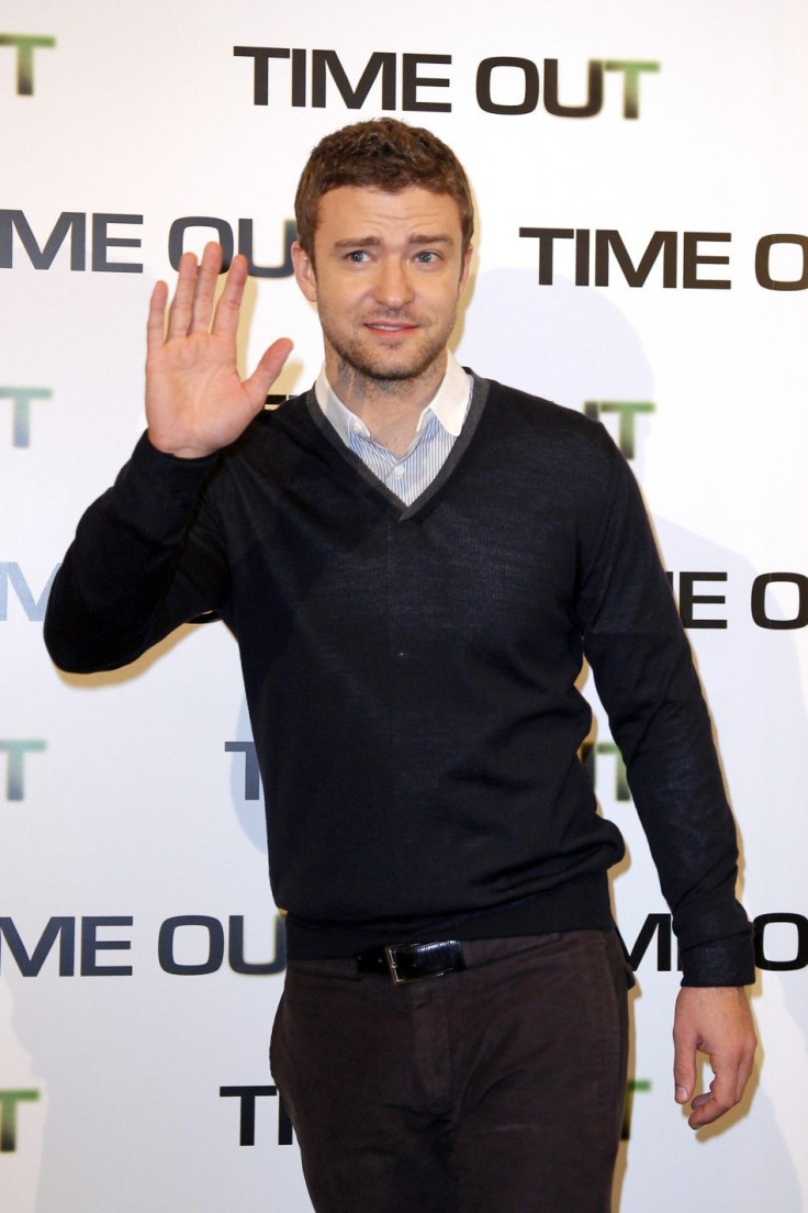Cast member Justin Timberlake poses for photographers to promote his latest movie &quot;In Time&quot; in Paris