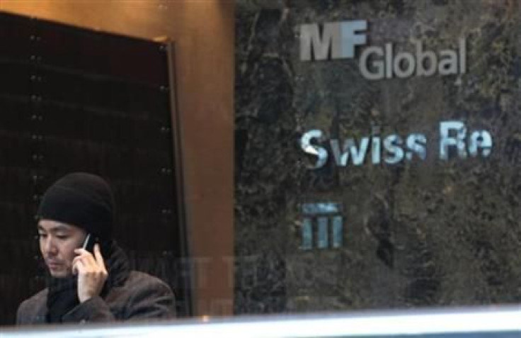 A man talks on the phone inside the office complex where MF Global Holdings Ltd have an office on 52nd Street in midtown Manhattan New York