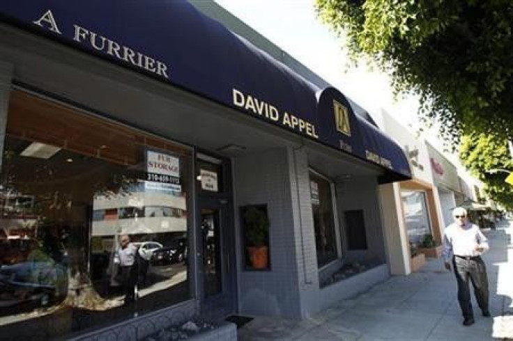 A man walks past a fur store in Beverly Hills, California September 23, 2011.