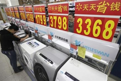 Customers inspect washing machines at a supermarket in Wuhan