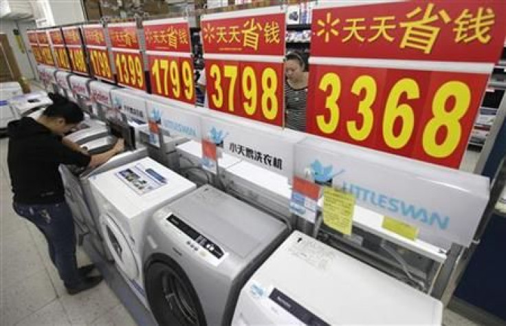 Customers inspect washing machines at a supermarket in Wuhan