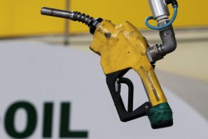 A gas pump is seen hanging from the ceiling at a petrol station in Seoul June 27, 2011.