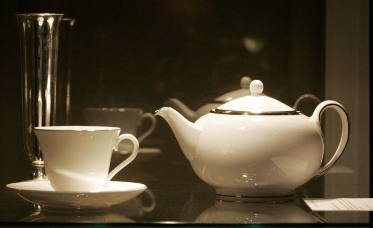 Tea pot and cup