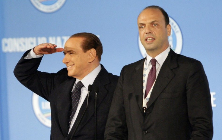 Italy&#039;s PM Berlusconi gestures next former justice minister Alfano after Alfano was elected as new party&#039;s national political secretary during the PDL party national congress in Rome