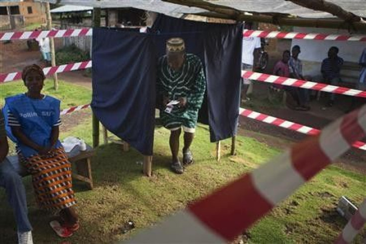 A Liberian man exits a polling booth