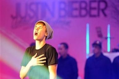 Canadian singer Justin Bieber performs after switching on the Christmas lights at the Westfield shopping centre in west London November 7, 2011.