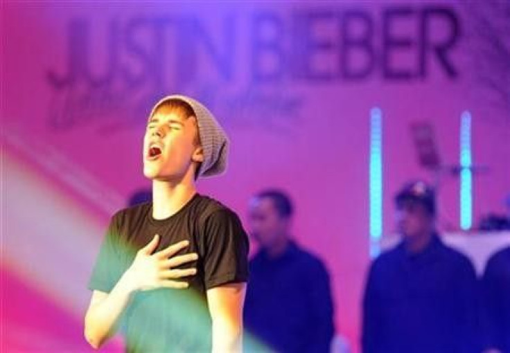 Canadian singer Justin Bieber performs after switching on the Christmas lights at the Westfield shopping centre in west London November 7, 2011.