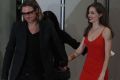U.S. actor Brad Pitt and his partner Angelina Jolie arrive at the Japan premiere of Pitt's film &quot;Moneyball&quot; in Tokyo