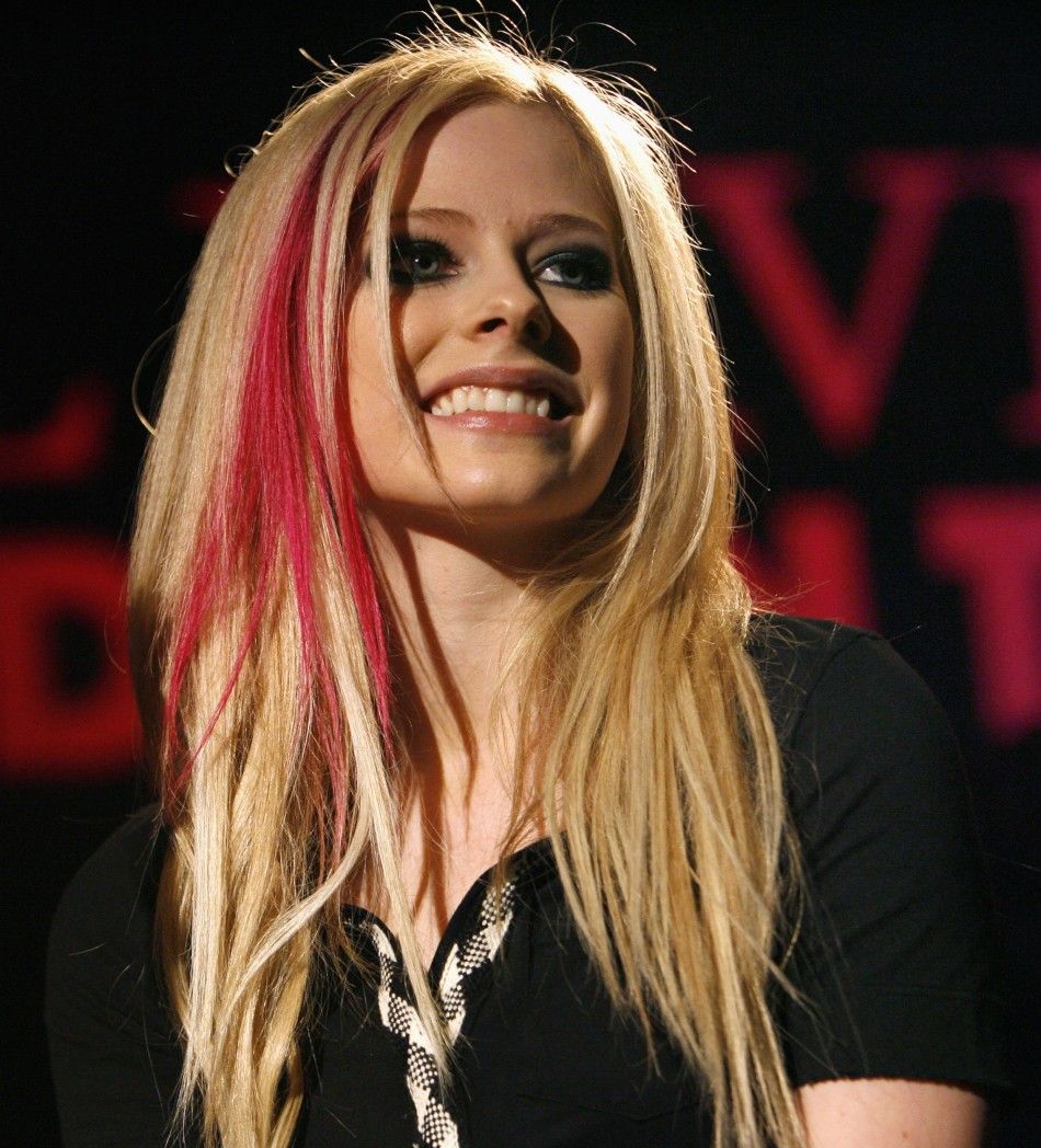 Avril Lavigne smiles during a news conference for the announcement of her 2008 Best Damn Tour in Los Angeles