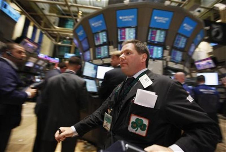 Traders work on the floor of the New York Stock Exchange