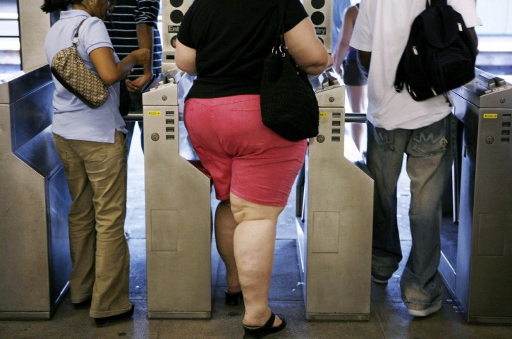 Subway commuters walk through the turnstiles while leaving the U.S. Open in New York September 4, 2007.