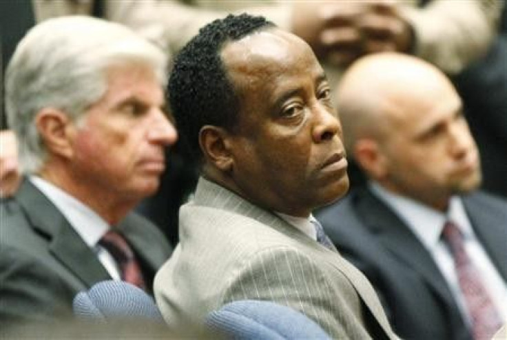  Conrad Murray next to his attorney, J. Michael Flanagan, after his guilty verdict on  November 7, 2011.