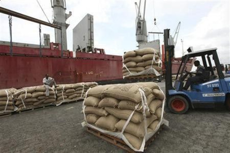 Sacks of cocoa are loaded onto a ship at the port of Abidjan