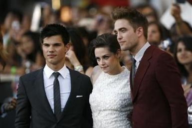Cast members Taylor Lautner (L), Kristen Stewart and Robert Pattinson (R) pose at the premiere of &quot;The Twilight Saga: Eclipse&quot; during the Los Angeles Film Festival at Nokia theatre at L.A. Live in Los Angeles