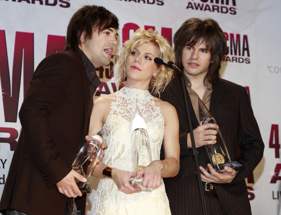 The Band Perry pose with their awards backstage at the 45th Country Music Association Awards in Nashville