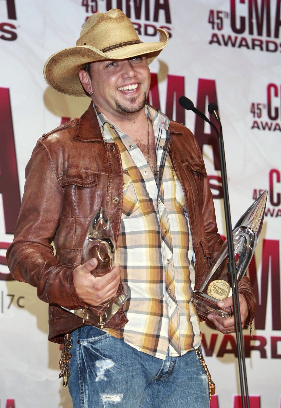  Jason Aldean poses with his awards backstage at the 45th Country Music Association Awards in Nashville