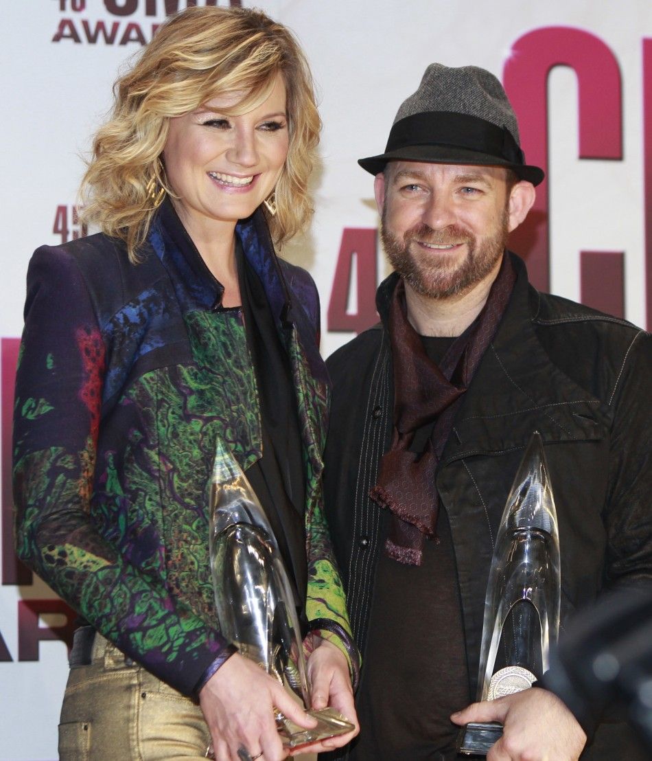 Jennifer Nettles and Kristian Bush of Sugarland pose backstage after winning best vocal duo at the 45th Country Music Association Awards in Nashville