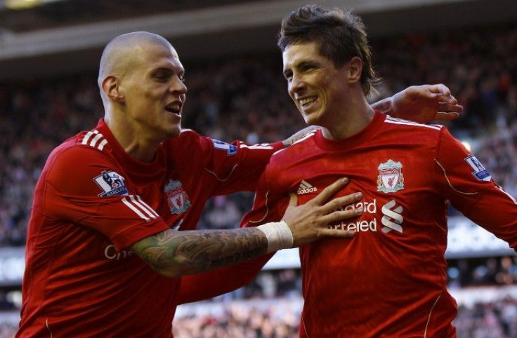 Liverpool's Fernando Torres (R) celebrates with Martin Skrtel (L) during their English Premier League soccer match against Blackburn Rovers at Anfield