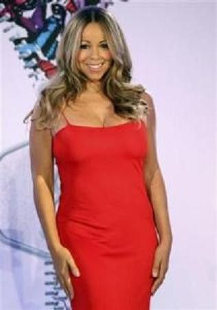 Mariah Carey poses during a press conference announcing that she will be the new brand ambassador for the weight-loss program Jenny, formerly known as Jenny Craig, in New York November 8, 2011.