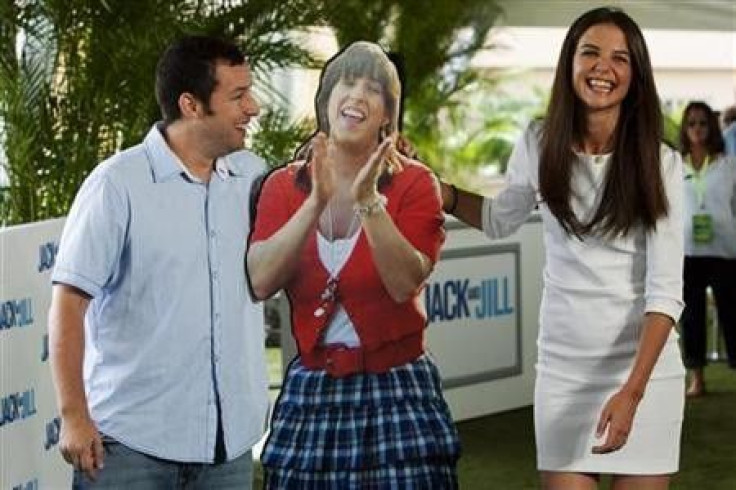 U.S. actors Adam Sandler and Katie Holmes pose with a cardboard cutout of Sandler&#039;s character during the launch of their film &#039;&#039;Jack and Jill&#039;&#039; in Cancun