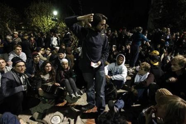 A demonstrator takes votes from a group of demonstrators during an Occupy Cal demonstration outside Sproul Hall at the University of California in Berkeley, California November 10, 2011.