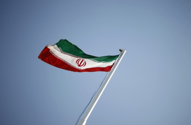 An Iranian national flag flutters during the opening ceremony of the 16th International Oil, Gas & Petrochemical Exhibition (IOGPE) in Tehran