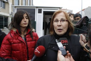 Former hostages Canset Usta and Sude Gundogdu of the hijacked Kartepe ferry speak to media outside a police station in the northwestern Turkish town of Silivri, near Istanbul