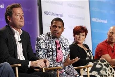 Host Nick Cannon (2nd L) and judges Piers Morgan (L), Sharon Osbourne and Howie Mandel attend the NBC panel for the television show &#039;&#039;America&#039;s Got Talent&#039;&#039; during the Television Critics Association summer press tour in Pasadena, 