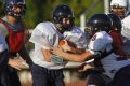 McClintock High School Chargers football players take part in a scrimmage in Tempe