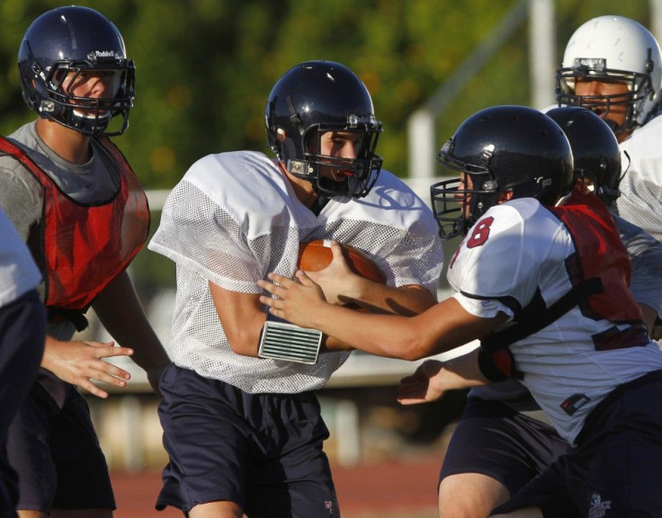 McClintock High School Chargers football players take part in a scrimmage in Tempe