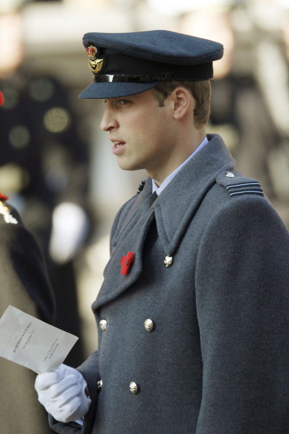 Britains Prince William sings a hymn during the annual Remembrance Sunday ceremony at the Cenotaph in London November 13, 2011. 