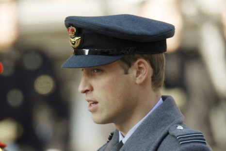 Britain's Prince William sings a hymn during the annual Remembrance Sunday ceremony at the Cenotaph in London November 13, 2011. 
